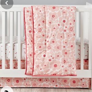 New Crib skirt in pink floral pattern by the Land of Nod
